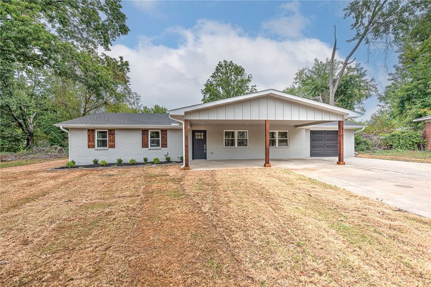 Welcome to this beautifully updated totally renovated 4-bedroom, 2-bathroom home in one of Bentonville’s most desirable locations! This 1,892 sq ft home has been renovated from the studs up and sits on a generous 0.28-acre lot. No detail was overlooked – from the brand-new roof, HVAC, electrical, and water heater, to new insulation, luxury vinyl plank flooring, quartz countertops, cabinetry, and appliances. Enjoy spacious living with built-in storage, two linen closets, and an extra-large primary closet featuring a custom-built vanity. Both bathrooms feature stunning tile work that brings a luxury feel to the space. A large walk-in pantry in the mudroom and a drop zone locker make everyday organization easy. The deep one-car garage with side-mount opener easily accommodates a tall truck or SUV. The fully sodded yard and fresh landscaping complete this total transformation. Located just 1.6 miles from the Bentonville Square, 1 mile from the new Walmart Home Office, and 0.8 miles to Thaden School.