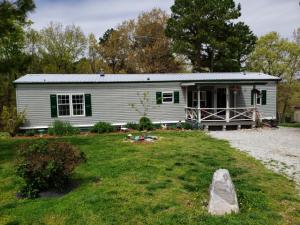 Looking for that country spot between Branson, MO and Harrison, AR? Well maintained 2006 single wide mobile home features 2 bedrooms and 2 bathrooms. Right at an acre of unrestricted land with fencing for the fur babies. Front and back covered porch's, garden area and mature landscaping. Cash or conventional financing only, no owner financing available.
