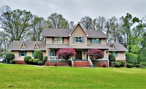 EYE CATCHING 2 STORY HOME WITH 4 or 5 BEDROOMS ON OVER 3 ACRES IN EASTON ADDITION IN CLARKSVILLE! This home borders the Corp of Engineers at the back, chain link fenced back yard with a nice sized deck with part of it screened in. Relaxing covered front porch with beautiful landscaping all around and, a walk out unfinished partial basement. Inside you have a Large Dining Room, Good Size Kitchen W/Pantry, Large Mud Room, Living Room, Master BR and Bath with Jetted Tub and Shower, a half bath and, Guest Room Downstairs. Upstairs you have not only apossible 3 more bedrooms and, full bath, but, a Large Media Room with Wet Bar! This home already has the High Speed Fiber Optic City Internetinstalled. Seller's are offering a $3,000 carpet allowance at Full Price, to replace upstairs carpet.