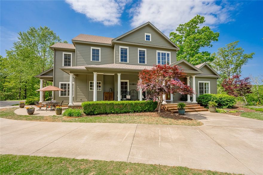 Custom-built estate home on 5.21 acres in the premier east Fayetteville school district. New deck, new paint and many upgrades. Main floor features a native stone fireplace with open living and dining. Well-equipped kitchen with 6-burner gas range, pot filler, custom alder wood cabinets, white quartz counters, island and walk-in pantry plus a breakfast area and wet bar. The primary suite has a sitting room and luxurious bath. A laundry room, mud room, 3-car garage and guest bath complete the first floor. Upstairs offers a large media room and 3 additional bedrooms all with ensuite baths and walk-in closets. The heated and cooled finished basement has another full bath, concrete storm shelter, utility room and 2 other rooms for added flexibility. Usable space beyond the Bermuda grass lawn for adding a pool, guest house or shop. Energy efficient with geothermal HVAC, high-efficiency water heaters and spray foam insulation. Secluded location but less than 10 minutes to schools, dining and shopping.