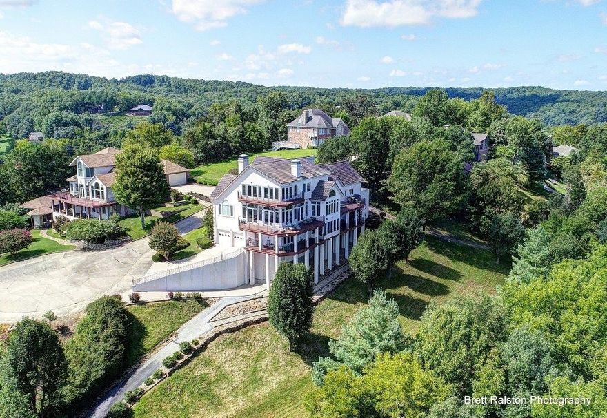 Priceless Panoramic Views of Beaver Lake! This exceptional custom built home has 6000 sf and sits 1.63 acres overlooking Beaver lake. 4 Large Bedrooms and 3 1/2 baths. Each room has it's own private balcony and views of the lake. A paved, landscaped walkway will take you to your own private dock and 435' of water frontage.