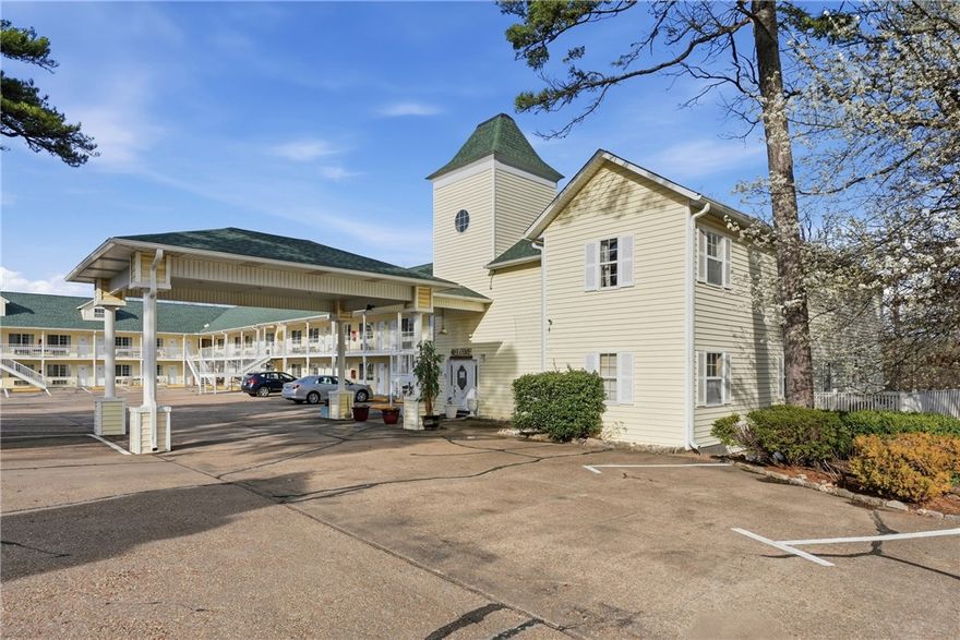 Incredible income producing hotel located in the heart of beautiful Eureka Springs, AR. This well maintained property features 60 guest rooms across 2 floors, many with balcony access, and sits in a prime location on Hwy 62 with excellent visibility and traffic flow. Room mix includes king rooms (with and without jetted tubs) and double queen rooms, appealing to a wide range of travelers. Each room is equipped with a TV, and select rooms offer mini fridges, microwaves, and coffee makers for added guest comfort. Guests enjoy a swimming pool and easy access. A proven, consistent occupancy record year over year. This is a true turnkey investment with immediate cash flow, plus major capital improvement already completed, a brand new roof in 2024. On site living quarters are included, ideal for owner operators or on site management. Conveniently located 1.7 miles from The Great Passion Play, 2.9 miles from Historic Downtown Eureka Springs, and directly on the Yellow Trolley Route (Stop #46), a huge draw for tourists.