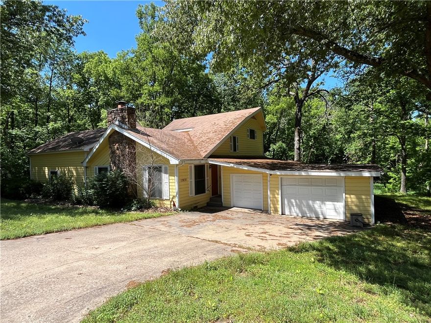 OPPORTUNITES ARE KNOCKING ON THIS BEAUTIFUL RARE FIND! Close to all Siloam Springs has to offer, yet the feel of being out of the hustle and bustle of the city! This is a very unique property with some TLC could turn into a wonderful cozy dream home, wooded back with privacy, fenced in yard, screened in porch, WOW! This property offers a 3 BR/2.5 BA unique floorplan, or it could also be 2 BR/2.5 BA with LOTS of living space, depends on what you want to create! There is TONS of storage, a small shop/workshop inside the garage PLUS extra space for lawnmower AND a golf cart parking garage! Maybe you convert this into additional living space? Another option is to shut the inside upstairs off with access outside...create some income with an AIRBNB or a bedroom rental? Maybe in-laws downstairs and adult upstairs? NOTE: the stairs are at an odd angle so be careful going up them. The main floor has a spacious area.........again, the opportunities to add some of your personal imagination and touch will turn this into dream!