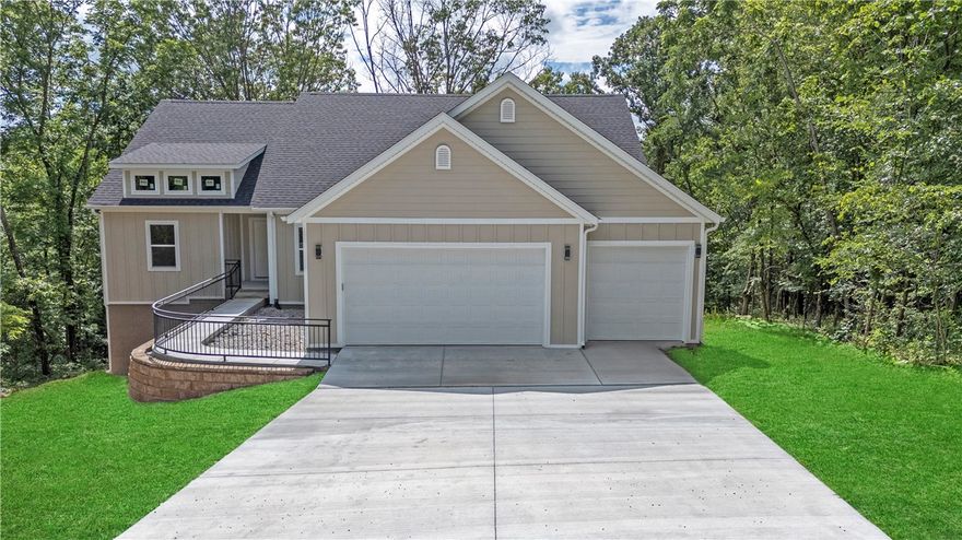 Welcome to your brand-new dream home, perfectly positioned at the end of a quiet cul-de-sac surrounded by trees on three sides for ultimate privacy and tranquility. This stunning new construction, completed in 2025, offers a seamless blend of modern finishes, spacious living, and a peaceful natural setting — all within Bella Vista’s highly desirable community. Step inside to find an open and split floor plan designed for both comfort and functionality. The living room features a cozy fireplace with gas logs and a gas starter, ideal for relaxing evenings at home. A dedicated office with elegant French doors provides the perfect space for remote work or quiet reading. The gourmet kitchen is a true highlight — complete with quartz countertops, stainless steel appliances, and a large pantry for ample storage. From the kitchen and living areas, step out onto the private back deck, where you can enjoy serene views among the trees. Seller Offering $10,000 in concessions with an acceptable offer.