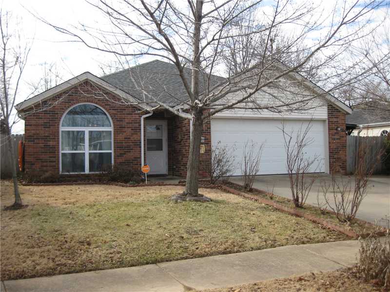 Neat home in an established neighborhood. Excellent location close to everything. This home has been well cared for & is in very good Condition. Brick & vinyl exterior, 3 BR, 2 BA, attractive kitchen, ceiling fans, 2-car garage, security system, & kitchen,refrigerator conveys to buyer! Great fenced yard. 13x40 covered patio/RV parking area. Must see!