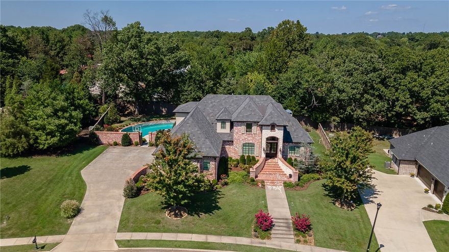 Gorgeous custom home located in the gated Heritage Hills Subdivision. Conveniently located 1.5 miles from I-49, Arkansas Children's Hospital, and Tyson Headquarters. Offering 4500 sq. ft., 5 bedrooms, 4 baths, gourmet Kitchen with double refrigerator, and laundry room with double washer and dryer. The backyard oasis features a kidney-shaped pool with a tanning deck and hot tub. The back patio is perfect for entertaining and has a wood-burning fireplace. Call today to schedule your showing.