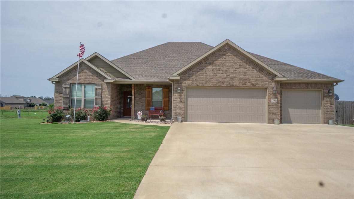 Peaceful country style neighborhood with larger lots and a community pavilion await you at this lovely 4 bedroom home with lots of upgrades, plus a relaxing sunroom. Enjoy great sunsets and relaxing weekends in your new home which features a large custom kitchen with soft close doors & drawers plus under cabinet lighting. Top grade exotic granite and top of the line Frigidaire appliances, upgraded luxury vinyl wood look plank flooring. Large storage building in fully privacy fenced backyard with 50 amp service for RV. Welcome home!