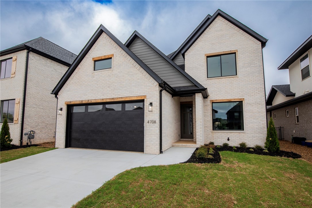 Step into elevated living with this stunning new construction home inside the gates of Shadow Valley, perfectly positioned just across from the golf course. With 4 bedrooms, 3.5 bathrooms, this home is a canvas for luxury living. Designed for both style and function, the first level features all main living to include an office|flex space The open-concept kitchen and living area is complete with double ovens, a gas range, stainless appliances. Entertain outside under covered patio with gas fireplace. Upstairs, you’ll find three additional bedrooms, two bathrooms. Don’t miss your chance to call one of Rogers' most desirable golf communities home—schedule your showing today and start imagining the possibilities. Welcome HOME!