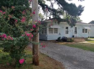 CHARMING DUPLEX in a quiet neighborhood. Each two bedroom unit features central heat & airconditioning, carport, and a nice yard to enjoy. Great investment property or live in one side and rentthe other for extra income!