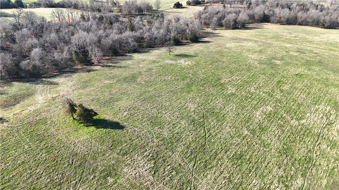 Don't miss this prime tract of land ready for your new home build! Mostly open, all useable 13.8 acres provides a country feel with room to breathe. Great access with county road frontage and short distance to pavement. Rural water, electric, fiber at road. Quick access to Hwy 412 and nearby amenities, 25 minutes to Fayetteville/Springdale. This scenic property combines an ideal out of town setting with convenience to necessities. Call for an appointment to take a look today! Utility availability is the responsibility of the buyer or buyers agent.