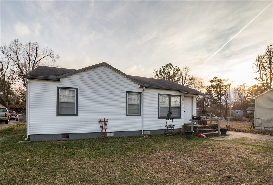 Super cute starter home or investment property centrally located near schools, I-49 & Springdale's up and coming downtown. 3 bedrooms/1 full bath with central heat & air, remodeled bathroom with new tile/sink & toilet. New hardwood flooring in LR and hall. New paint & counters, new stainless steel sink and dishwasher/stove and new tile in kitchen. New blinds/ceiling fans and fixtures. Buyer can do inspection but seller does not want to make any repairs (so to be sold as-is) no major known issues though.