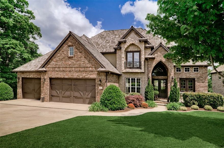 Envision yourself spending time enjoying Views of Sunrises & Sunsets from your covered deck.
Living Room w/Beamed Vaulted Ceiling, Wall of Windows, Double Fireplace to a Fully Equipped 
Kitchen, SS Appliances, Custom Cabinetry,spacious Granite Island, ideal for casual dining. Private Master Suite, FP, WIC, Deck. Wood floors adds richness to formal DR, double crown molding & an Office w/box beamed ceiling. Upstairs 3 bedrooms, 4 wic’s, 3 baths. Lower level designed for Family fun & Entertaining, den/game area, FP, granite & stone bar, D/W, Frig./Wine Cooler; theatre room, bedroom, full bath, storage (or golf cart). Treed & shrub secluded deck, Koi pond, Stone Patio, Firepit overlooking sweeping views of golf course, water & woods. Seller will pay $5000 towards Buyers closing costs.