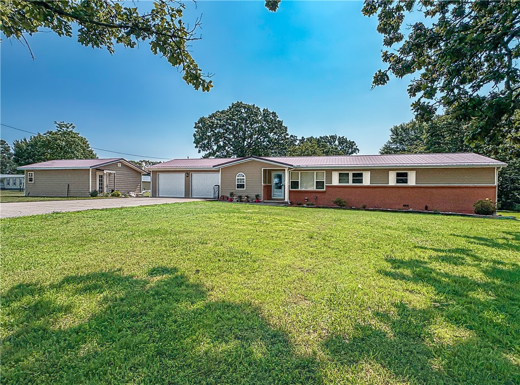 Bergman School District with small acreage! This three bedroom, two bath home has many updates, has over 4 level acres with fencing and a corral, is located on pavement and is very convenient to Bergman school. There is so much offered by this property, with a concrete block storage building, 480 sqft studio that could easily be another living space, partial and semi-finished basement, two car attached garage, beautiful kitchen with lots of cabinets and granite counters. Updates over the past few years include but are not limited to: new HVAC, new flooring, metal roof, new septic system, renovated kitchen & bathrooms. This is one you need to hurry to see!