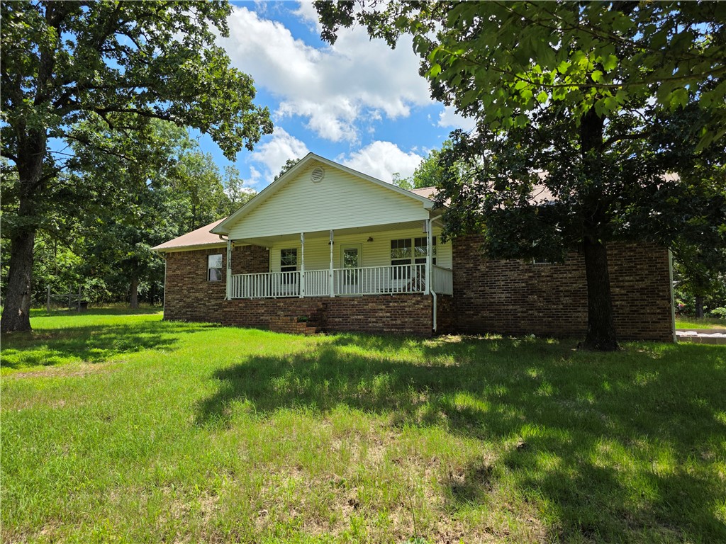 8 secluded acres featuring a brick home with 4 bedrooms and 3 bathrooms and a long lasting metal roof. Designed with a split floor plan and Jack and Jill bathroom for 2 of the bedrooms. The primary bath has a jetted tub/shower combo with double sinks. Ideal for hunting, gardening, homesteading, etc. The property includes a chicken coop and has approximately a 1-acre fenced area. There is a storage area with the detached carport, storage building, and storage shed. Located just minutes from Dover.