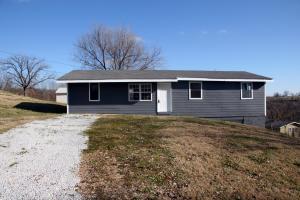 Perfect first time home or rental property. 3 bedroom 1 bath with work area in garage/basement area. Laminate flooring throughout. Freshly painted and move in ready.
