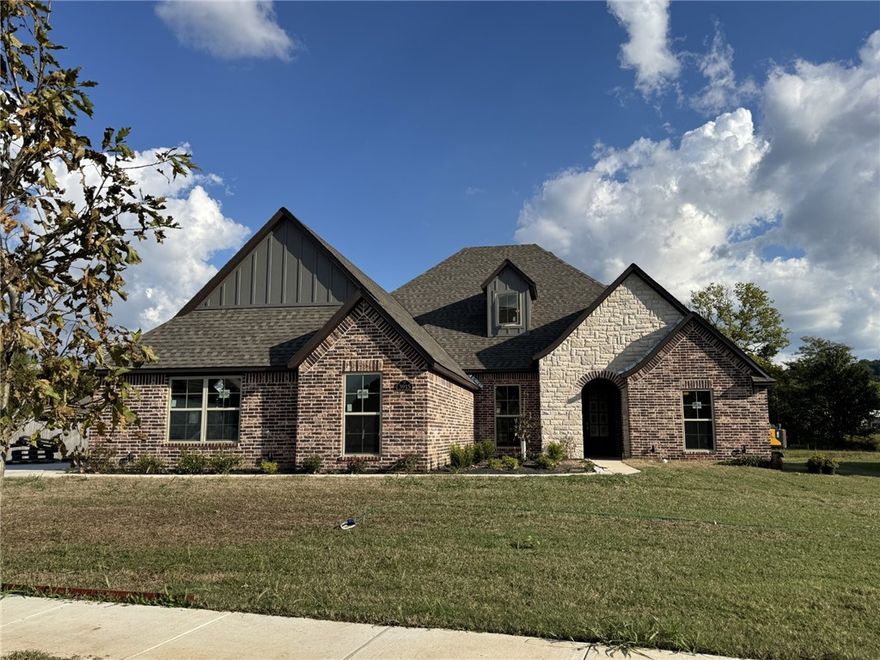 This beautifully designed residence offers a seamless open-concept layout, blending the living, dining, and kitchen areas for effortless everyday living and entertaining. The kitchen is the heart of the home, featuring a hidden walk-in pantry, stylish finishes, and plenty of space to gather.
A charming brick wall accent in the master bedroom and carefully selected tile details add warmth and personality throughout the home. Upstairs, a spacious bonus room provides endless options—whether you envision a media room, playroom, or private home office.
With a three-car garage, there’s ample storage for vehicles, hobbies, and more.
This home combines thoughtful design, character, and functionality—ready to welcome its next owners!

Please note: 
Lot line adjustment is in progress.