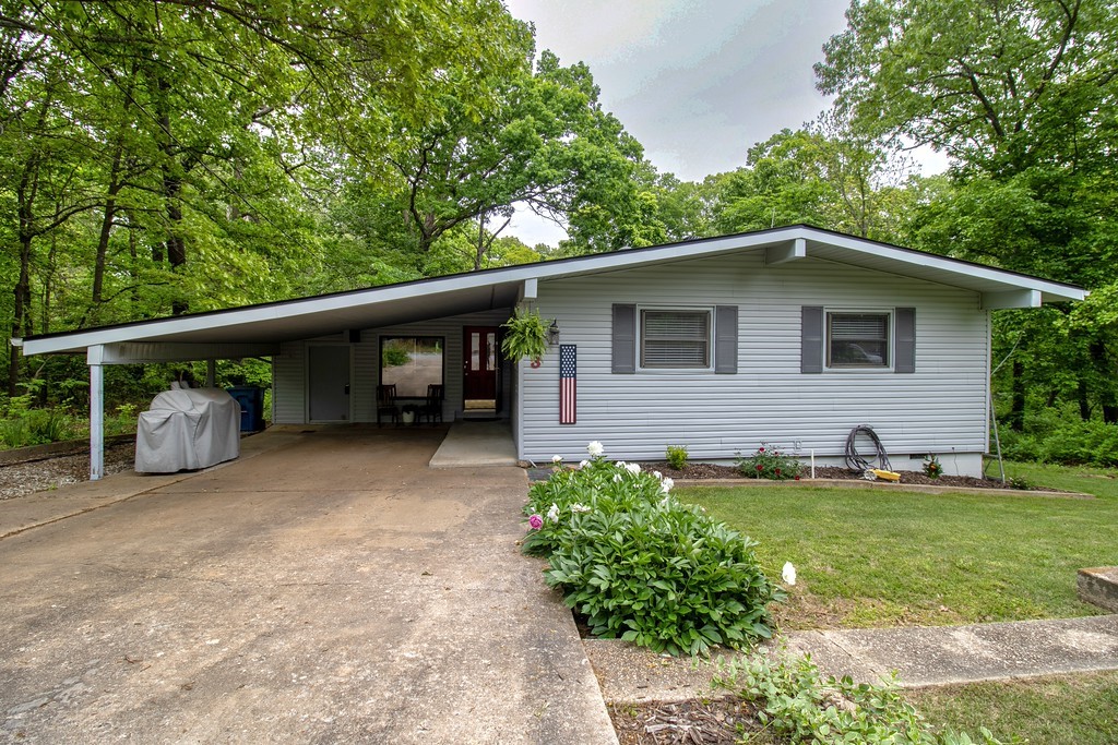 Inviting 2-bed, 2-bath home at 3 Lancaster Drive, Bella Vista, AR! Nestled in a peaceful, wooded setting, this well-maintained property features an open floor plan, spacious bedrooms, and a cozy living area with abundant natural light. Enjoy nature from the back deck, with easy access to trails, golf, and lakes. Perfect for full-time living or a quiet getaway.