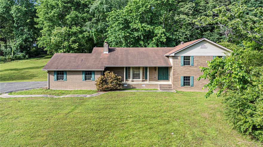 Welcome to 411 Marina Road! This 4 bedroom, 3 full bath, 1 half bath split-level home offers space, character, and a fantastic location just minutes from Lake Dardanelle. The inviting family room features a cozy woodburning fireplace, creating the perfect gathering space for family and friends. Step outside and enjoy both a covered balcony patio and covered back porch, ideal for entertaining or unwinding after a long day. With its functional layout, multiple levels of living space, and close proximity to the marina, boating, fishing, and outdoor recreation, this home offers a great opportunity to enjoy comfort, space, and lake-area living all in one property.