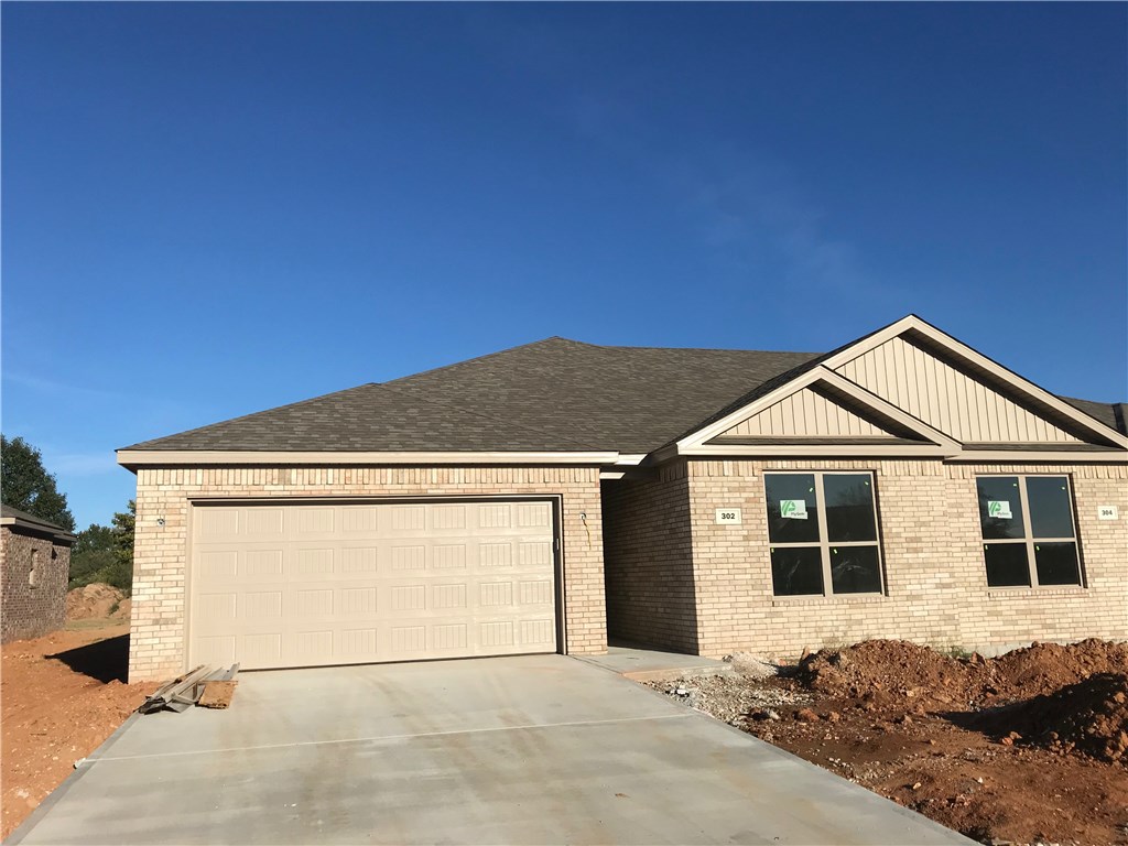 Spacious 3 bed 2 bath home in central Pea Ridge just minutes from Bentonville and Rogers. This open floor plan features hardwood tile throughout the common areas and in the kitchen enjoy granite counters and stainless steel appliances including the fridge. This home also features large carpeted bedrooms and in the master bathroom you will find plenty of storage and counter top space with dual sinks and a large walk in shower. Also included with this home is a front load Washer and Dryer! Outback lounge or BBQ on the spacious covered patio that opens up to a level spacious yard. Lawn care and landscaping is included. Yards are not fenced other than a divider fence between units. No Cats allowed, and only dogs under 30 pounds allowed with an additional $250 refundable pet deposit. This unit is apart of the Willow Run duplex community that is professionally managed.