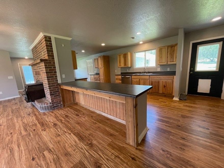 Country living just minutes from town.  This 3 bed/2 bath home is situated on 1.81 acres and fenced on all four sides. Ideal for a hobby farm with a blend of cleared flat outdoor space with mature shade trees.  The interior offers a bright, inviting layout with generous living spaces. The two car garage has been converted to a bonus room that is not included in the square footage.  There is an office that could easily be transformed into an extra bedroom. The open eat-in kitchen has new appliances that flows into a family room with an abundance of natural light, a wood burning stove and a picture window that overlooks a wooded backyard.   This well-maintained property is just 15 minutes away from downtown Bentonville and in Bentonville School District.    Prime location, lots of potential, this property won’t last long!