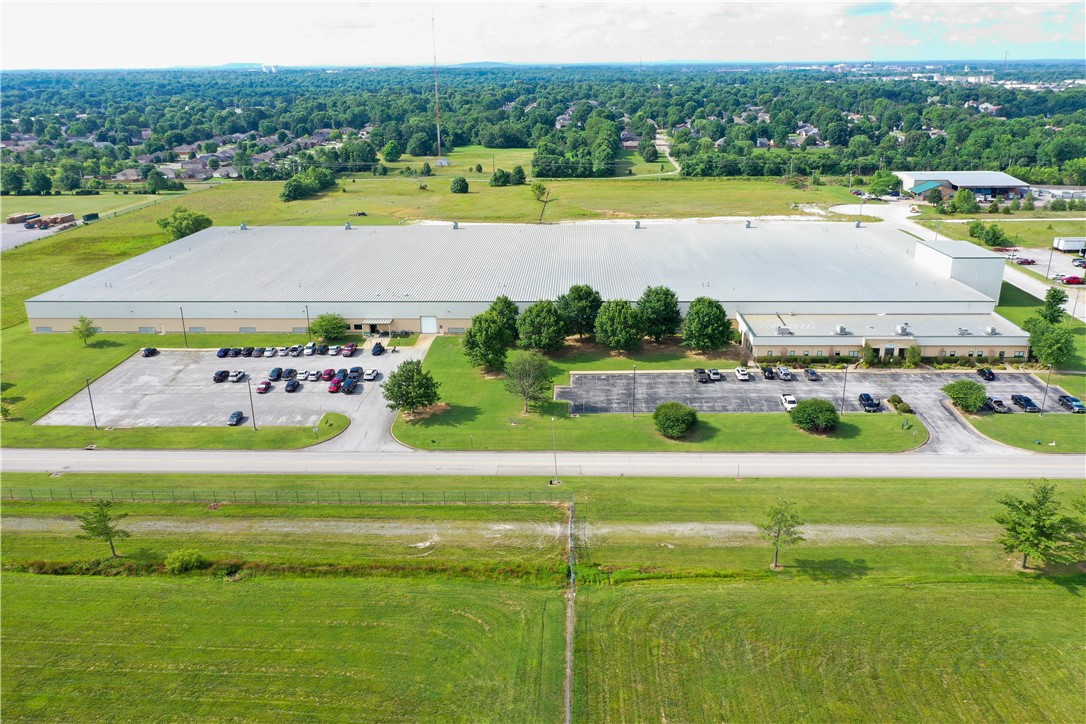 Warehouse/Industrial space located with easy access to I-49 (94,000 VPD). ±11,000 SF of professional office space. One roll up, drive in door and 22 loading docks. Up to 24' ceiling height. Entire warehouse is sprinkled. 1.6 miles from the new Walmart corporate campus.