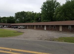 ** 16 unit Investment Property** with great rental history and cash flow!! This low maintenance brick 16 unit complex is located in Clarksville and only a short walk two blocks to college of the Ozarks.