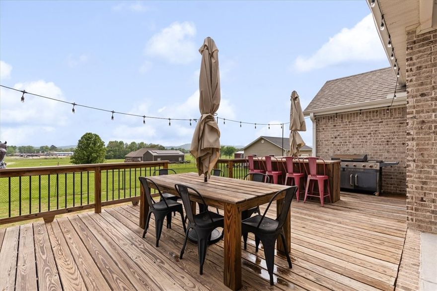 Gorgeous all brick, modern farmhouse with open concept layout situated on nearly a 1/2 acre that is within walking distance of schools and downtown Prairie Grove! Ready for backyard barbecues and all the summer activities! Upgrades include beautiful oversized kitchen island, hardwood flooring and fully tiled primary shower.  Owner's suite offers a relaxing retreat with exposed beams and ample space. Step outside to enjoy the generous lot, providing plenty of room for outdoor living, complete with oversized deck, grill, wood dining table built to fit perfectly and stone fire pit area large enough for the whole family to gather.  Great place to relax and watch the beautiful sunsets. High end GE Cafe appliances, including refrigerator. 
Patio furniture, firepit, playset outdoor umbrella, and custom drop zone in entry to convey!