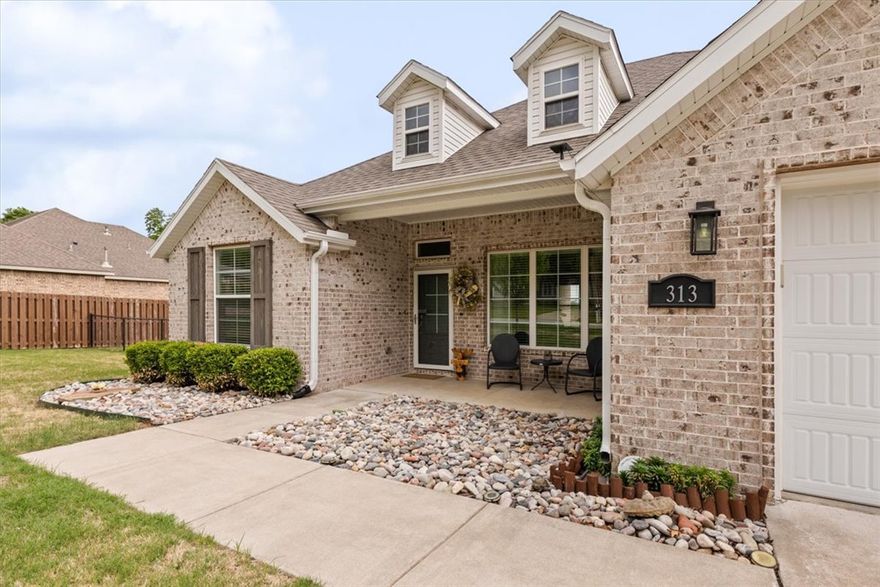 SELLER IS OFFERING $2,500 IN CLOSING COSTS/CONCESSIONS! Gorgeous all brick, modern farmhouse with open concept layout situated on nearly a 1/2 acre that is within walking distance of schools and downtown Prairie Grove! Ready for backyard barbecues and all the summer activities! Upgrades include beautiful oversized kitchen island, hardwood flooring and fully tiled primary shower.  Owner's suite offers a relaxing retreat with exposed beams and ample space. Step outside to enjoy the generous lot, providing plenty of room for outdoor living, complete with oversized deck, grill, wood dining table built to fit perfectly and stone fire pit area large enough for the whole family to gather.  Great place to relax and watch the beautiful sunsets. High end GE Cafe appliances, including refrigerator. 
Patio furniture, firepit, playset outdoor umbrella, GE Cafe refrigerator and custom drop zone in entry to convey!