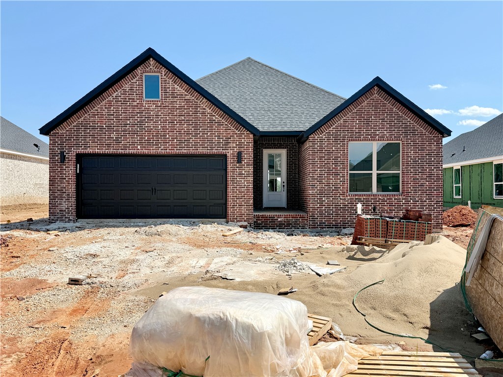 Pea Ridge boasts a variety of activities, all set against the town's scenic beauty. With abundant outdoor recreation, a strong community atmosphere, and affordable living, Pea Ridge stands out as one of Northwest Arkansas' top emerging communities.Step into the Falcon Plan, where LVP flooring spans the living spaces and every detail is thoughtfully designed, from tiled showers to premium 3CM granite countertops throughout. The utility room, with striking decorative tiles, offers direct access to the primary bedroom, making laundry effortless. The primary bedroom serves as a serene retreat, featuring exposed wood beams and large windows that fill the space with natural light. A cozy nook in the living room adds functionality, ideal as a study.The open-concept layout seamlessly connects the kitchen, dining, and living areas, flowing into a covered back patio that offers serene views of your tree-lined lot. For a limited time rates starting at 4.99% OR $7,500 from builder & up to $4K from preferred lender.