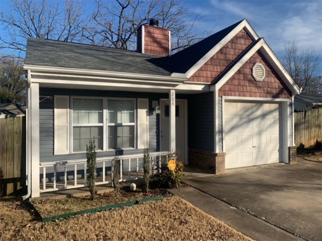Clean and Cozy upgraded 3 bedroom, 2 bath home. 1 mile to the Walmart Home Office. 1 mile to the Coler Mountain Bike Preserve. Ceramic tile throughout, wood burning fireplace, fenced yard. Exterior walls double insulated. Siding, windows, water heater, HVAC and ceramic flooring all upgraded, 5 years new!
