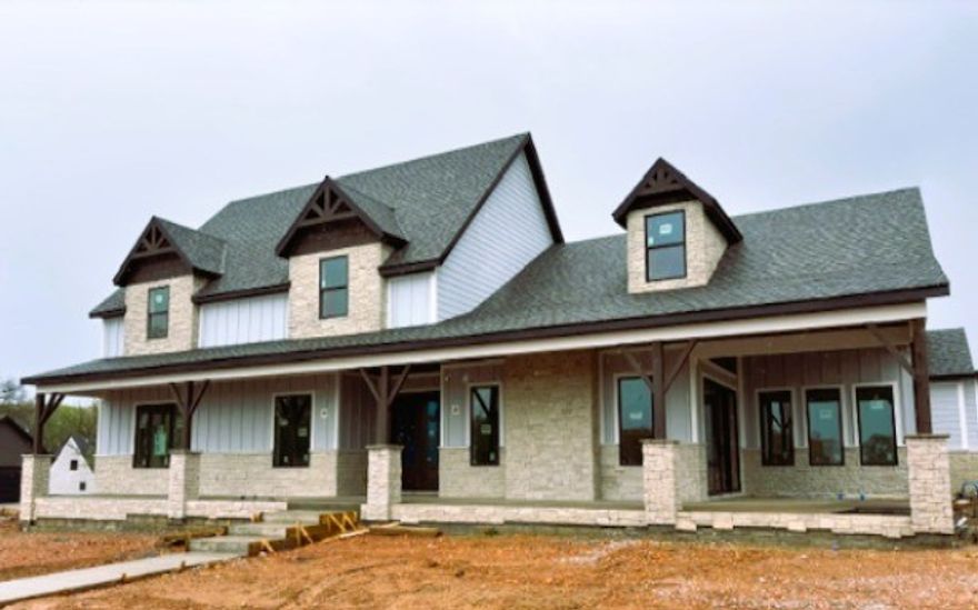 Built by the 2024 Parade of Homes gold medal winning builder! Discover The Laney floor plan in the Big Sky community.  This spacious 2 story home boasts a waterfall quartz kitchen island, Cafe appliances with a 6 burner gas range, oversized windows, and integrated outdoor space for seamless family living and entertaining. The elegant main suite includes a soaking tub and shower combo, while thoughtfully designed areas offer both spaces for socializing and private retreats for children to play and grow. With stylish interiors, a three-car garage, The Laney provides the perfect blend of comfort and convenience located in the Bentonville School District.  This large, corner lot is just a short walk from the community pavilion. Located just 2 miles from the Bella Vista by-pass, 5 miles from Coler Mtn, 7 miles from downtown Bentonville, and 8 miles from Wal Mart Home Offices!