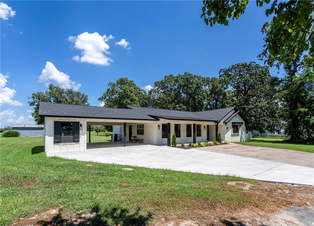 Nestled among the trees you will find this totally renovated home boasting over 2600 square feet. The re-imagined floor plan is open and inviting with 4 bedroom and 2 full baths including a tiled walk-in shower and soaking tub. There is also an additional bonus/flex space to use for your home office, game or craft area. Custom cabinets with granite counters, a large pantry and gas log fireplace add to the charm. This Hobby Farm is a 5 acre canvas to make your own. Come check out this beauty!