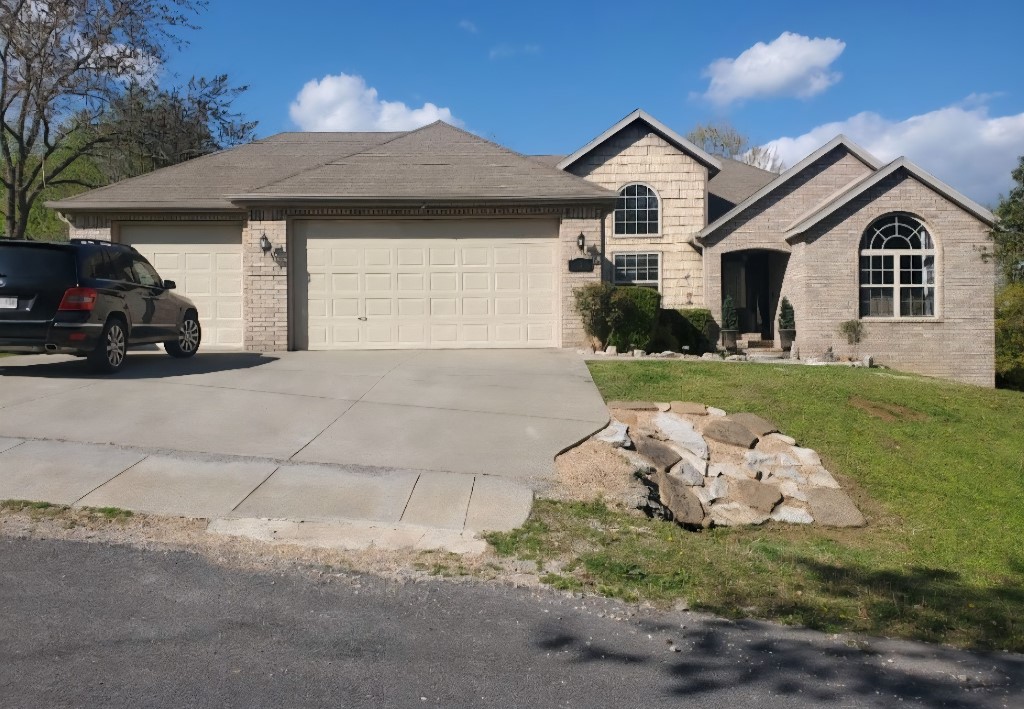 A Bella Vista home can be yours with all the POA amenities at a low price. Golfing, lakes, pools & more. This well-maintained home has a lot to offer, seclusion, charm, and room to grow. Located on a dead-end street. The home sits on a gently sloping oversized corner lot. Vaulted ceilings throughout greet you as you enter into the living room with a romantic gas fireplace perfect for those cool nights. Enjoy the outdoors in a private backyard on your deck with 3 generous size bedrooms with 2 full baths. A hobbyists dream with oversized three-car garage. A bonus small side fenced yard for your fur babies. The kitchen has granite counter tops and lots of cabinets space for the chef at heart. The main bedroom is located on one side of the house for privacy, while the other two oversized bedrooms share a jack 'n jill bath on the other side. Step outdoors to enjoy the wooded surroundings in a manicured yard full of rose bushes and mature trees. Enjoy easy access to the new 100m bike trails within the neighborhood.