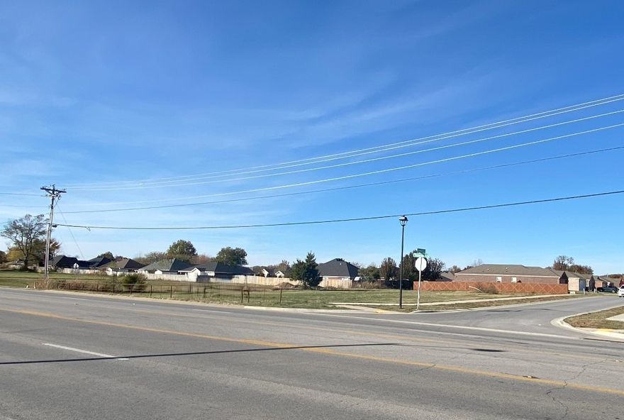 31,938 sq.ft. (0.73 acres) commercial lot along US Hwy 412 in east Springdale. Property is in an opportunity zone. Located at northwest corner of E. Robinson Avenue (Hwy 412) and Loveland Street in front of Barberry Court Subdivision. Public water, public sewer, and electric are all located on site (not across the highway). Property is Springdale city limits, and is zoned C-5 Thoroughfare Commercial. Property is generally clear and level with no existing buildings on site. Sidewalk along Loveland Street has already been installed.