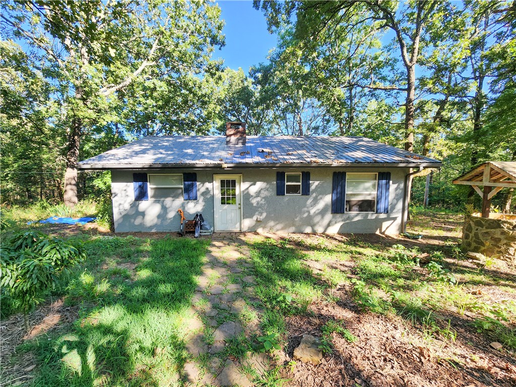 Scenic Elkins Acreage with Pond ā Ideal for Homesteading or Weekend Retreat! Tucked away in the heart of Elkins, this peaceful property offers the perfect canvas for your homestead dreams. With a serene pond, gently rolling land, & plenty of wildlife, itās a nature loverās paradise ready for transformation. The existing home needs significant work but offers solid potentialāwith two bedrooms, one bathroom, a cozy living room featuring a fireplace with insert, a kitchen, and a utility room. Renovate to suit your needs, or use the footprint to build the rural retreat youāve always imagined. Whether you're looking to raise chickens, plant a large garden, or simply enjoy the outdoors, this property is ready for a self-sufficient lifestyle. Deer, birds, and other wildlife frequent the area, adding to the natural beauty and peaceful setting. With just a short drive to Fayetteville, you'll enjoy the best of both worlds: country quiet with city convenience. Donāt miss this opportunity to create your own piece of paradise.