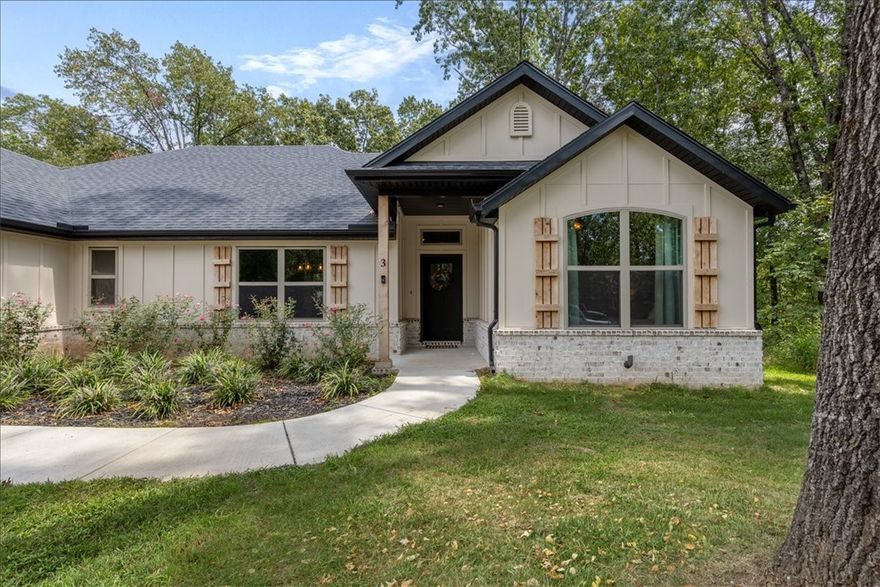 Wow! Check out this almost new home on the Bentonville/Coler Preserve side of Bella Vista! Get the best of both worlds with this location-Downtown Bentonville 15 min & short hop to hiking, biking, lakes & all Bella Vista has to offer. This Aaron Nickell built home offers a smart floor plan w/2 bedrooms PLUS a 14 1/2 x 11 office/flex room, & a separate library/den w/moody green paint, built-in shelves & barn doors-use it however you'd like! Open floor plan w/full view windows in main areas, 12x24 inch tile & wood floors (NO CARPET) 10 ft, tray & vaulted ceilings, spacious kitchen w/prep island, built-in oven & microwave, walk-in pantry & upgraded tile backsplash. Large primary suite w/10x14 bath featuring double vanity, soaking tub & 3x4 walk-in shower. HUGE 14x7 walk in closet. Upgraded wide trim & molding. 18 1/2 x 6 covered back porch, pet ready LEVEL fenced yard, Generac generator hookup & level drive w/room for 4 cars. Lovely exterior finishes, sharp black roof & gutters & 10x6 covered entry. So much to love!