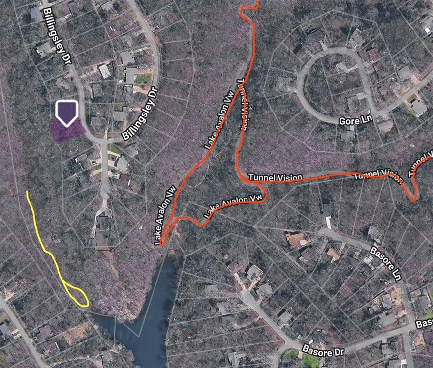 This .24-acre wooded lot offers the perfect canvas to build your dream home in the desirable Avondale subdivision. Imagine waking up to scenic views and having immediate access to everything that makes Bella Vista special. As a POA member, you'll enjoy incredible amenities including multiple golf courses, swimming pools, fitness centers, and so much more for just $16 per month. Outdoor enthusiasts will love being near Lake Avalon for fishing, kayaking, and waterfront recreation, plus you're minutes from world-famous mountain biking and walking trails that attract riders from across the globe. The gently sloping, wooded terrain provides natural beauty and privacy, while public water is available at the street. Located in the highly-rated Bentonville School District with easy access from Highway 71, this lot combines small-town charm with big-city convenience. This is an incredible value to start your Northwest Arkansas adventure. Don't miss this chance to build your future in one of America's best places to live!