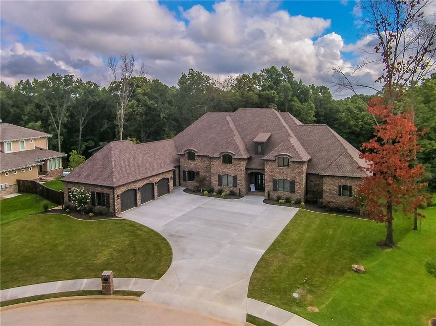 HUGE PRICE REDUCTION! - Investor says SELL...their lose could be your gain. This incredible custom designed home sits on over an acre with beautiful wooded views and wonderful outdoor space including grilling area, cover deck w/fireplace and lower fire pit area. Inside will find soaring ceilings, a fantastic kitchen area and more all on one level. The home was built by O.A.K. HOMES with designer touches and upgrades that make sense like the double sized fridge, butler pantry and huge master closet.