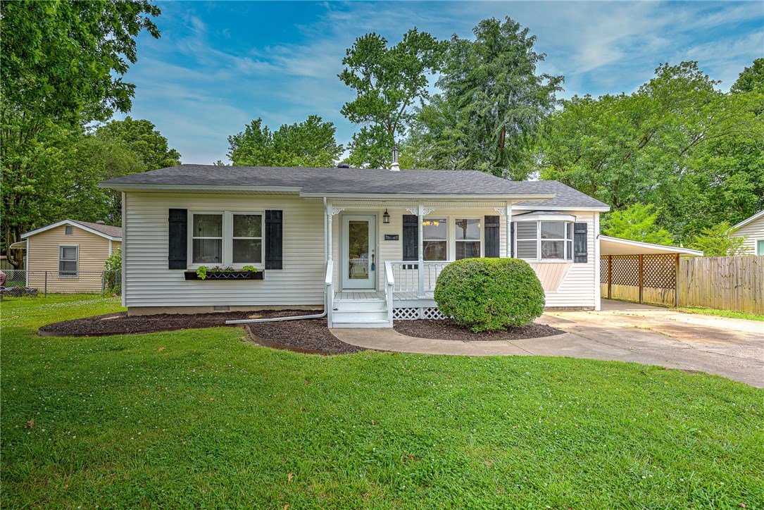 Quaint home located near downtown Rogers! This home is a perfect investment opportunity or for that person looking for charm! An open concept creates a great environment for entertaining family/friends, You can find beautiful hardwood floors throughout the home and wonderful natural light. The home has new paint and carpet. Spend time in the spacious backyard or enjoy the back deck! Home offers a carport and 2 storage buildings. Roof was replaced in 2019. Conveniently located just minutes from biking trails, parks, restaurants, shopping and attractions that Rogers has to offer!