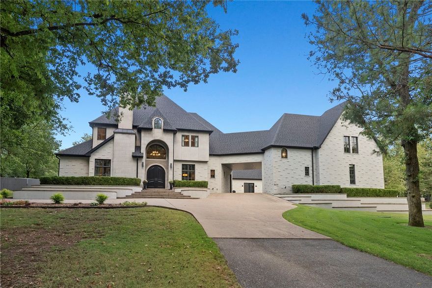 Stunning custom-built estate nestled on 2.3 park-like acres, featuring brilliant design elements throughout. A private circular driveway winds around the property. Located just ½ mile off Highway I-49, this estate offers unbeatable convenience to all that Northwest Arkansas has to offer. 5 minutes to Washington Regional, 10 minutes Mercy Hospital. The expansive primary wing spans over 1,000sf complete with a cozy sitting area, private office featuring a fireplace, and a versatile laundry room. Two spacious closets fit for royalty complete this luxurious retreat.
A dedicated theater room, exercise room, and a separate garage apartment with its own access. Upstairs, you will find three additional bedrooms, each with en suite bathrooms, along with a second living area featuring a kitchenette, game room, and a convenient third laundry area.
This exceptional property stands out on its own, offering a perfect blend of luxury, comfort, and functionality. It's a stunner.  See attachments for more info.