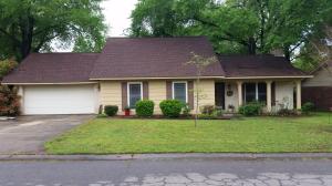 Close to everything is this well maintained 3 bedroom / 2 bath home with wood privacy fenced backyard. New deck, kitchen cabinets, countertops, paint, 2 inch wood blinds, garbage disposal, and windows. New roof in 2012. Lots of closet and storage space plus storage along full length of second story. Wood Burning fireplace with insert and a large garage with work area. Check this home out today.
