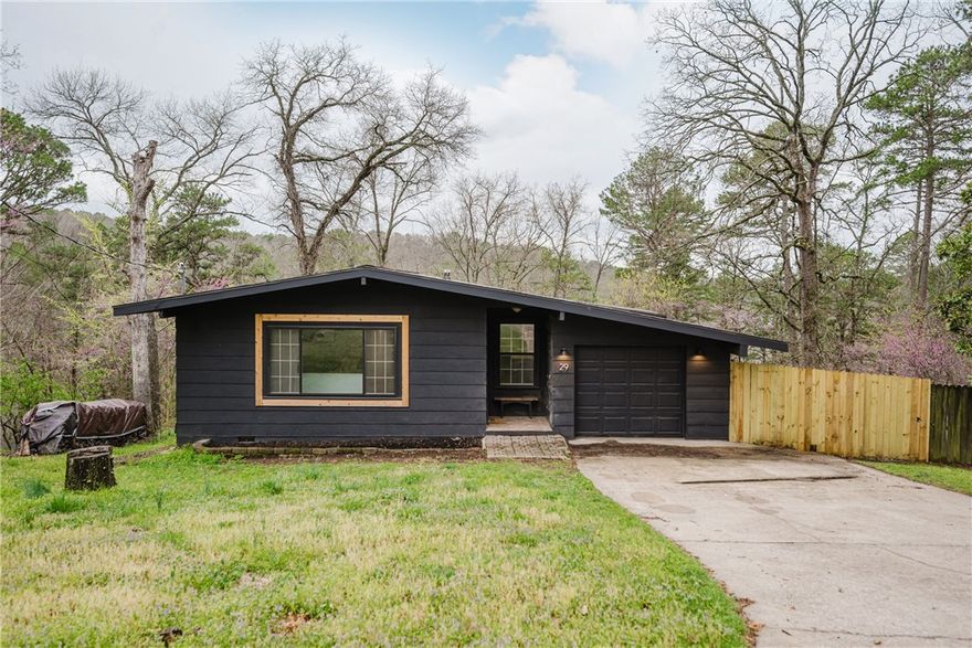 Seller is offering $3,000 in concessions! Welcome to 29 Platz in beautiful Bella Vista, Arkansas! This charming home offers a perfect blend of comfort and style, with ample space for both relaxation & entertainment. Step inside to find a living room with large windows, flooding the area with natural light & creating a bright, inviting atmosphere. The eat-in kitchen features a generous island. Enjoy the spacious covered deck, ideal for outdoor living, whether you're hosting a gathering or simply unwinding in privacy. The finished basement provides additional living space, perfect for a home office, recreation room, or guest area. Outside, you'll love the covered front porch, adding curb appeal & offering a peaceful spot to enjoy your morning coffee. This home is a must-see. Make 29 Platz your new sanctuary in Bella Vista just minutes from Lake Norwood & other Bella Vista amenities.