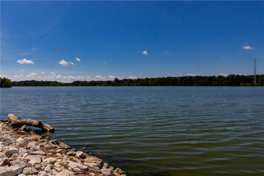 Opportunity is knocking loudly! Large lake front property on .56 acres with existing dock ready for your vision. Fishing, boating, entertaining or relaxing on your private dock. Year round full lake views can be as open as you like with thinning out vegetation to your desired level. This large home is a clean slate for you to create your own dream lake home. 3 bed, 2 bath. 3 car carport. Sold as-is. Seller will not do any repairs. Roof and siding are 9 years old. Home does not have central heat and air and pre-qual letter will need to acknowledge lenders loan approval without Central Heat & Air. Home is in a flood zone and requires flood insurance, seller pays $1400/year currently.