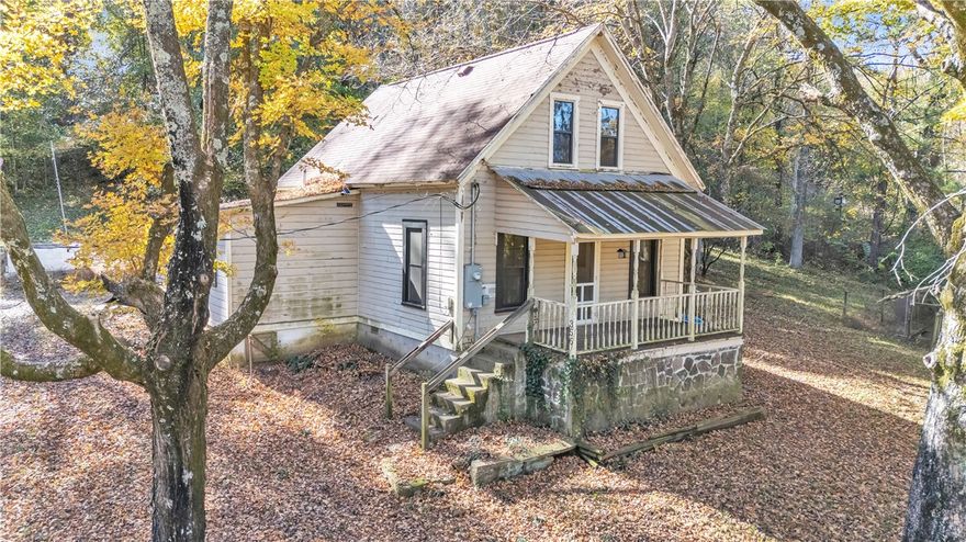 Rustic cabin originally constructed in 1865, loaded with potential and charming details throughout. Sitting on 15.08 acres with a 1200 sqft foot print this two story cabin has two bedrooms plus office, living, new walk-in pantry and nicely remodeled kitchen.  Located at the end of a dead end street with plenty of privacy and room for wildlife.  Wet weather creek runs through the north side of the land.  Cabin has been remodeled, kitchen updates include: new cabinets, new quartz countertops, new sink, new light fixtures, new appliances, new slate tile flooring.  Cabin has original wood flooring in downstairs bedroom, office and pantry bw sure to check out the cute antique pantry doors.  Bathroom remodel included new sink, new tile and new shower.  Upstairs updates included new Mini split, new laminate flooring added, new paint, new fixtures.  City water and well on site, outbuilding for livestock, large garden, chicken coop and 15.08 partially wooded acres.