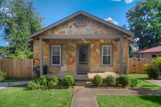 Welcome to this adorable Stone house in Fayetteville, AR! This cozy 2-bedroom, 1-bathroom home is less than half a mile from the University of Arkansas campus, shopping/dining entertainment district and only minutes from Dickson Street/Fayetteville Square! Zoned RMF-24, this land has lots of other possible developmental potential. The home currently has a lease in place and also holds a STR license.