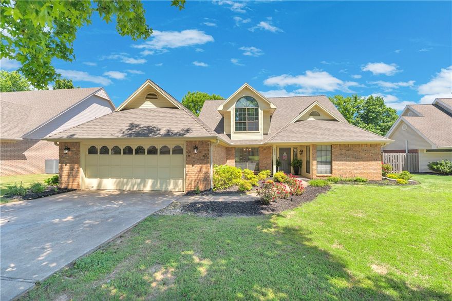 Welcome to your new home in the heart of East Fayetteville! This home’s inviting interior includes a soaring cathedral ceiling, cozy gas fireplace, and beautifully styled living spaces, creating a warm, elevated atmosphere. The highly desirable layout features a Primary Suite and dedicated Office on the main floor, plus two additional bedrooms upstairs with a versatile landing that works beautifully as a playroom, reading nook, or second living area. Outside, the flat backyard is private and easy to maintain. Located in an established neighborhood with no HOA, this home offers exceptional walkability and convenience, just steps from the Razorback Greenway and within walking distance to Confident Coffee and Butterfield Trail Elementary. Whole Foods, I-49, dining, and everyday amenities are only minutes away!
