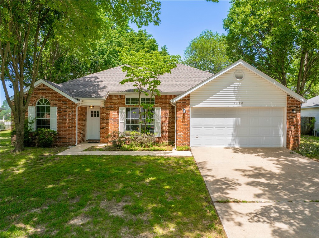 This beautifully refreshed 3-bedroom, 2-bath home is perfectly situated near Tyson Headquarters and shopping centers, offering both convenience and comfort. Inside, you'll find fresh paint, new vinyl flooring, and plush new carpet, creating a warm and inviting atmosphere. The updated kitchen adds a modern touch, while the primary bathroom boasts a new stunning walk-in shower with beautiful tilework. Spacious living areas and well-appointed bedrooms make this property ideal for relaxation and everyday living. With its prime location and thoughtful updates, this home is move-in ready and waiting for you to enjoy!