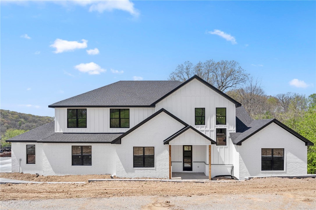 Welcome home to the beloved Eau Claire subdivision! Nestled on 1.25 acres with gorgeous valley views, this spacious 4-bedroom, 3.5-bath retreat offers 3,307 SF of thoughtfully designed living space with an upstairs bonus room—perfect for movie nights, play space, or a game room—as well as a dedicated office featuring a custom accent wall. The home boasts storage everywhere, so there’s a place for everything (and everyone). The oversized 900 SF garage includes custom epoxy flooring, ideal for projects, parking, or extra storage. At the heart of the home is a stunning chef’s kitchen with luxury finishes and a walk-in butler’s pantry—perfect for entertaining or keeping daily life organized. With 3 heating and 3 AC units, you’ll enjoy comfort in every season. Outside, take in the views from the expansive deck, offering a peaceful setting to unwind or entertain. Zoned for Bentonville Schools and just a short drive to trails, parks, and downtown, this home checks all the boxes for comfort, style, and location.