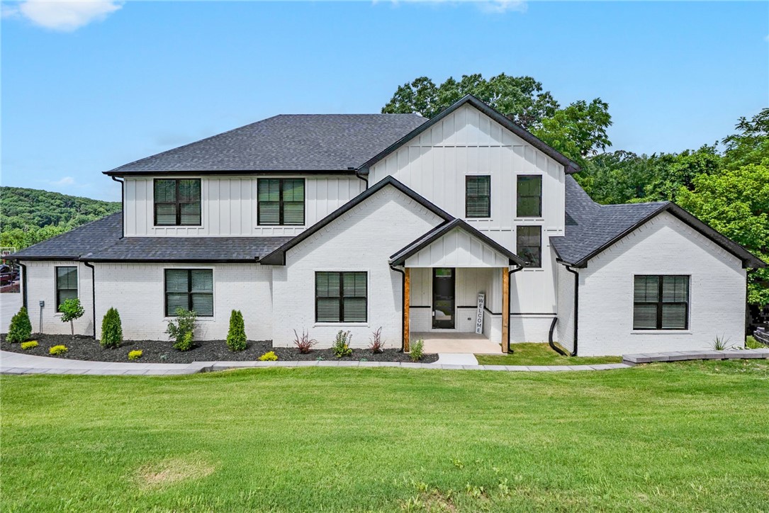 Welcome home to the beloved Eau Claire subdivision! Nestled on 1.25 acres with gorgeous valley views, this spacious 4-bedroom, 3.5-bath retreat offers 3,307 SF of thoughtfully designed living space with an upstairs bonus roomāperfect for movie nights, play space, or a game roomāas well as a dedicated office featuring a custom accent wall. The home boasts storage everywhere, so thereās a place for everything (and everyone). The oversized 900 SF garage includes custom epoxy flooring, ideal for projects, parking, or extra storage. At the heart of the home is a stunning chefās kitchen with luxury finishes and a walk-in butlerās pantryāperfect for entertaining or keeping daily life organized. With 3 heating and 3 AC units, youāll enjoy comfort in every season. Outside, take in the views from the expansive deck, offering a peaceful setting to unwind or entertain. Zoned for Bentonville Schools and just a short drive to trails, parks, and downtown, this home checks all the boxes for comfort, style, and location.