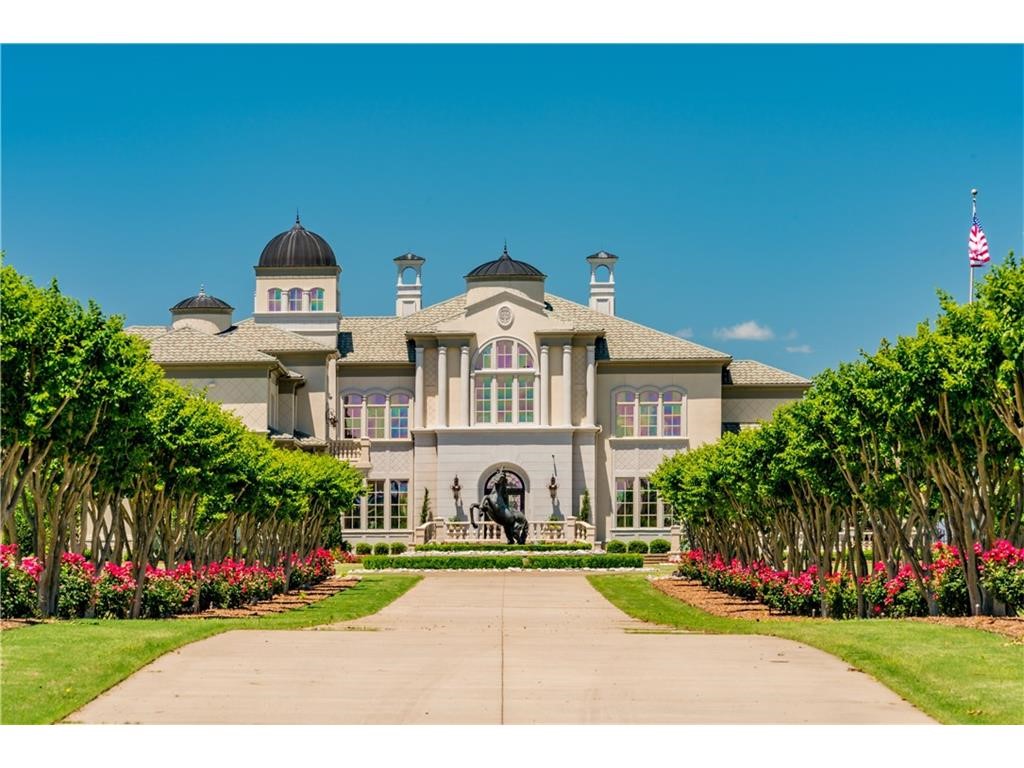 AUCTION BIDDING OPEN! Bidding ends November 16th. Previously listed at $8,900,000. Current high bid is $1,975,000. No Reserve Auction. Showings by Appointment. From the gated tree-lined drive to the dramatic double staircase, your 18,000+sf Mediterranean-style estate oozes grandeur. Imported Italian marble fireplaces, 30ft ceilings, intricate woodwork, and custom curved glass walls set your estate apart from everyday luxury. Exquisite spaces flow from one to the next, inviting you to bask in gracious amenities and connection to the outdoors. Exceptional design details reveal themselves throughout, from the Baccarat great room chandelier to the maximalist poker lounge clad in moody wood paneling. Enjoy sunsets from your backyard oasis as the kids play in their private outdoor area. An infinity-edge pool anchors your outdoor entertaining space and offers an expansive view. Watch the Razorbacks from your second living room, or host a large casual party for all ages in the game room under magnificent wooden tresses.